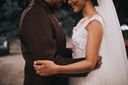 a couple happily making their wedding invitations